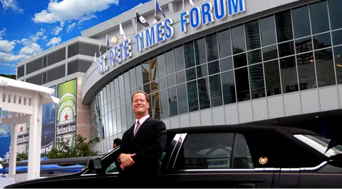 Tom Workman, Mr. OperaMan, beside a limousine