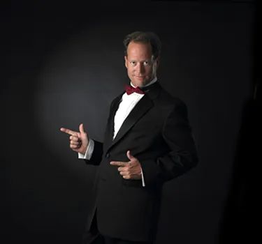 Tom Workman, Tampa's Opera Man, in a tuxedo and red bow tie